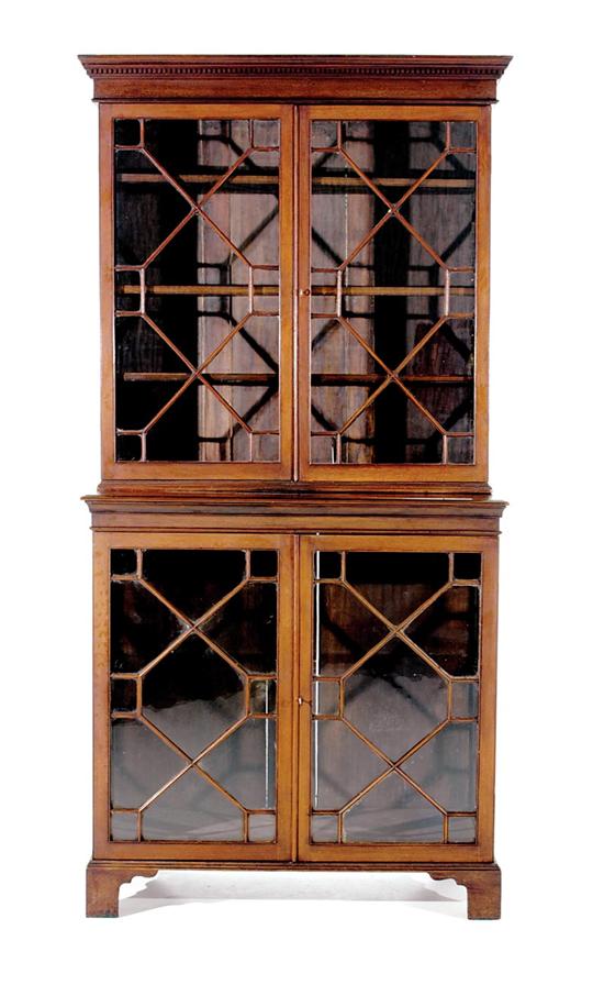 Appraisal: George III style mahogany bookcase circa dentil-molded crown over pair