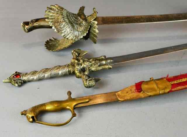 Appraisal: Various SwordsIncluding a Indian style sword with scabbard a brass