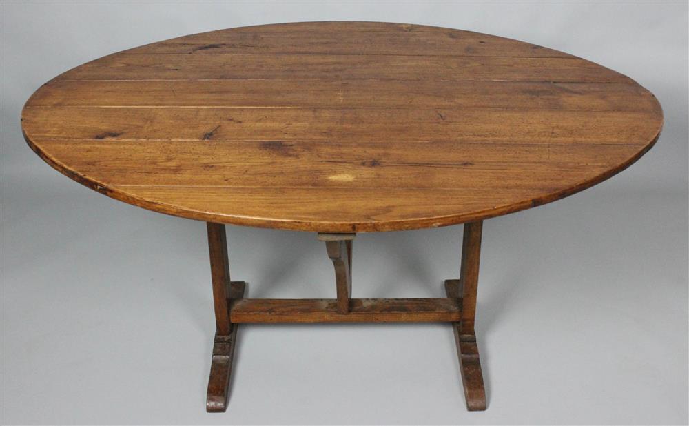 Appraisal: FRENCH PROVINCIAL ELM WINE TABLE with tilting oval top -