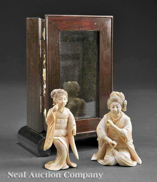 Appraisal: Two Japanese Carved Ivory Figural Okimono of Bijin each beauty