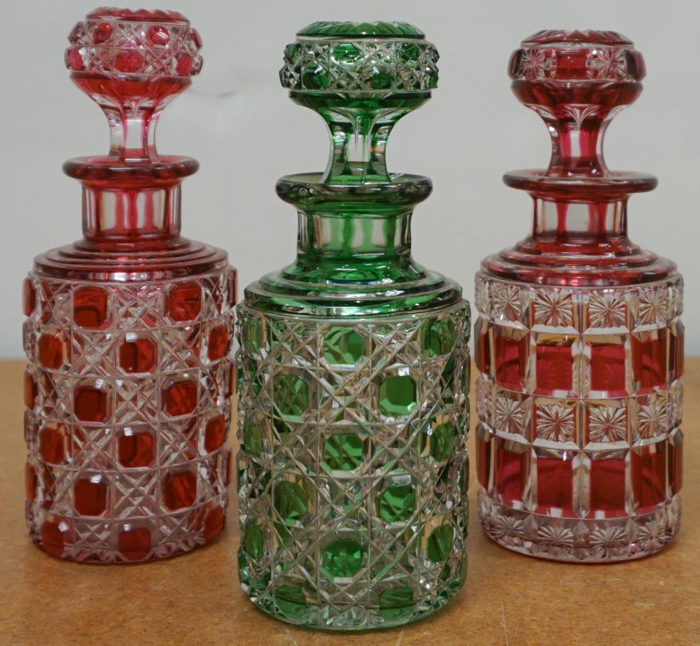 Appraisal: Three European Colored to Clear Crystal Dresser Bottles H in