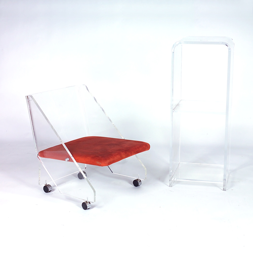 Appraisal: Lucite chair with chrome struts and rust-colored velvet upholstery on