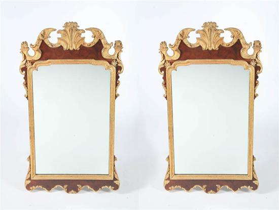 Appraisal: TWO LARGE CONTEMPORARY MIRRORS Elaborately carved gilt frames with burl