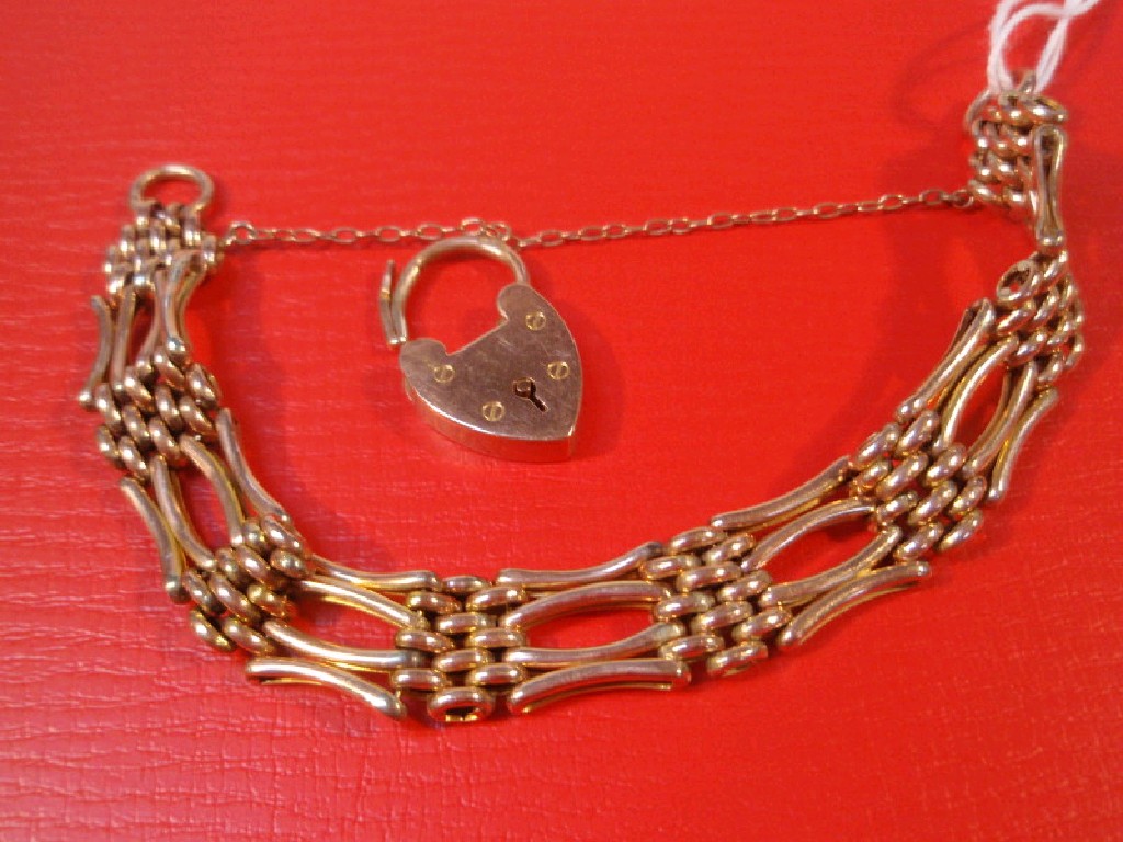 Appraisal: A ct rose gold four bar gate bracelet with padlock