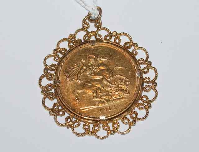 Appraisal: A GEORGE V GOLD COIN set in a gold mount