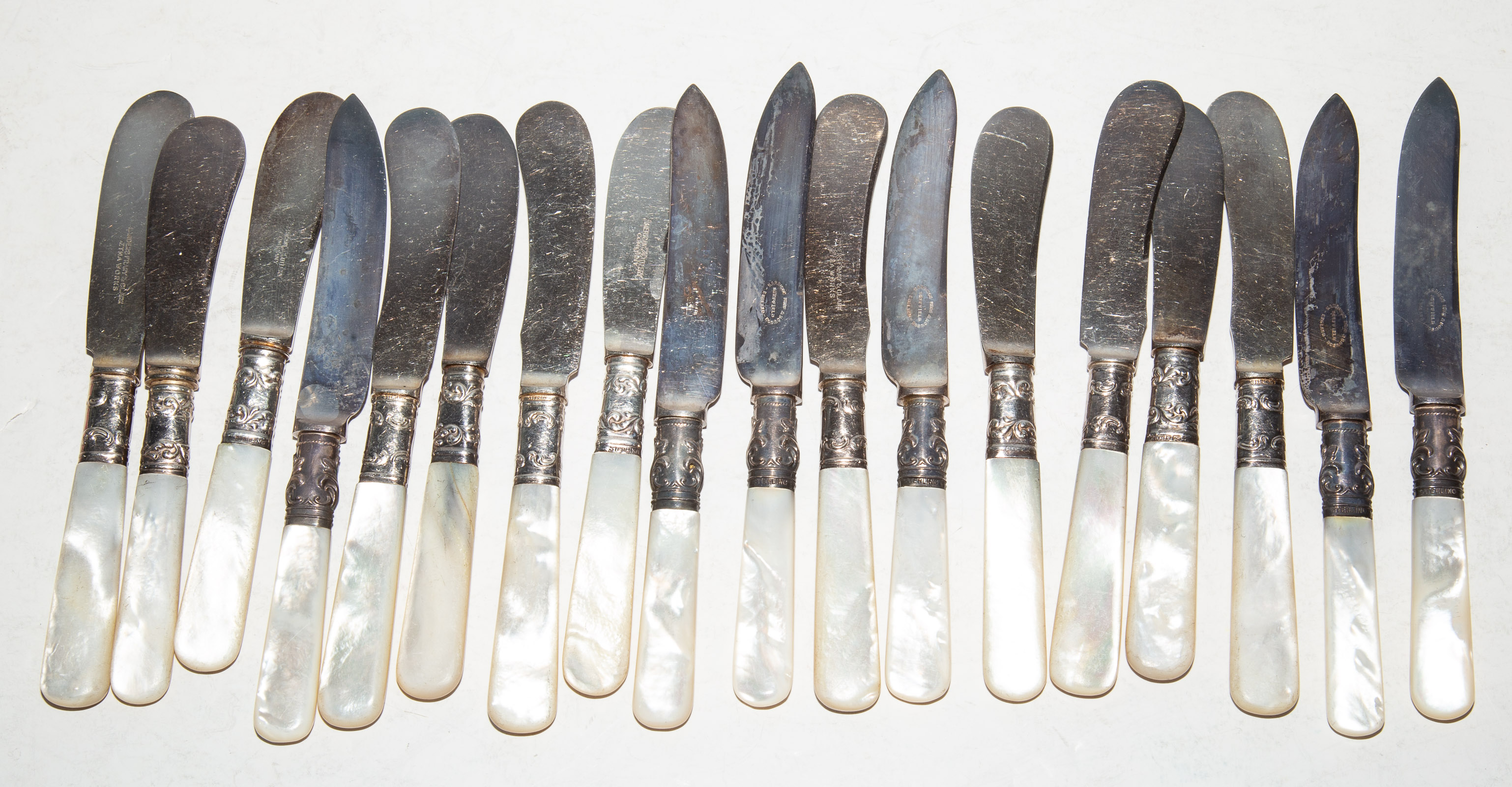 Appraisal: COLLECTION MOTHER-OF-PEARL HANDLED KNIVES Including twelve butter knives and six