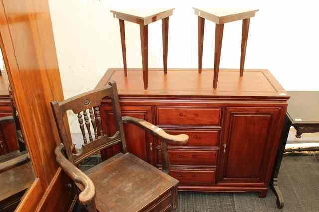 Appraisal: AN ORIENTAL HARDWOOD SIDEBOARD with four drawers flanked by panelled