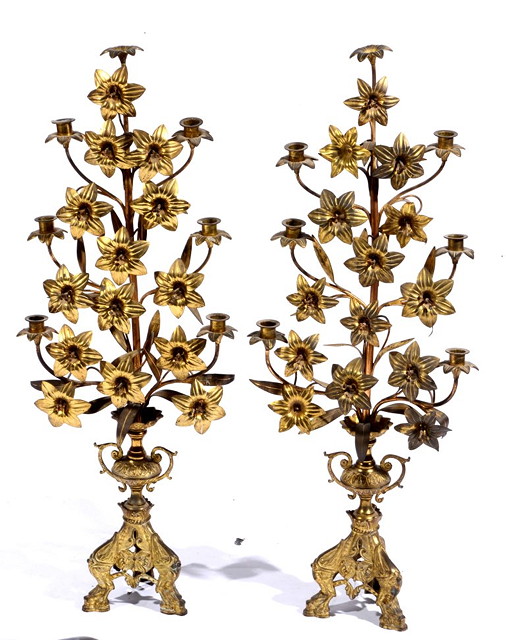 Appraisal: A PAIR OF GILT METAL TALL CANDLESTICKS with open flower