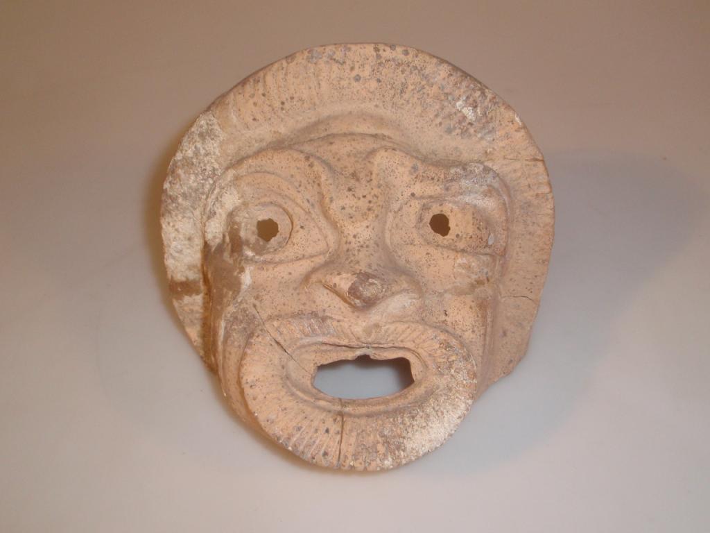 Appraisal: A restored Hellenistic terracotta theatrical comic mask with an open