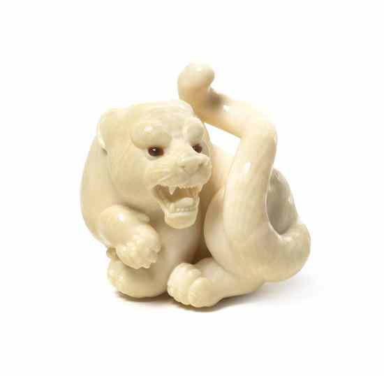 Appraisal: A Carved Ivory Tiger Netsuke Kangyoku Rishisai th century having