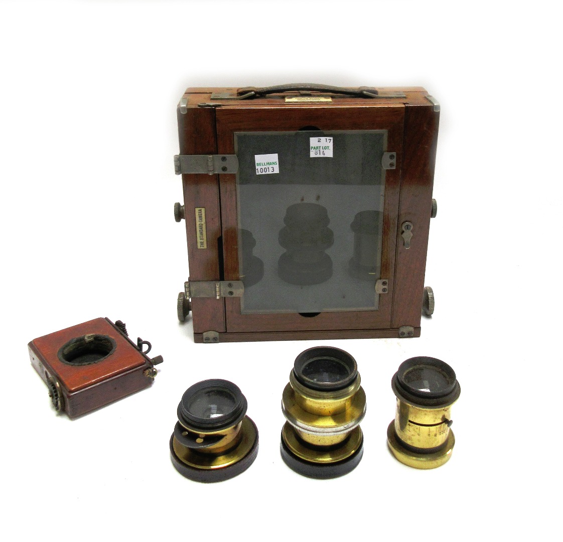 Appraisal: An early th century mahogany cased plate camera with applied