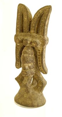 Appraisal: An Ibo ikenga with stylised horn headdress above a mask