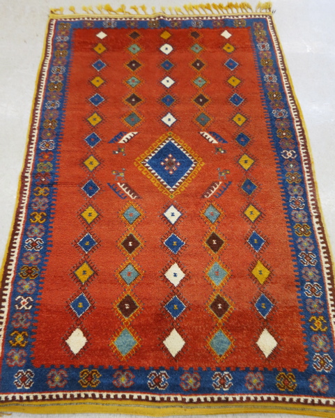 Appraisal: HAND KNOTTED MOROCCAN AREA RUG repeating columns of diamonds on