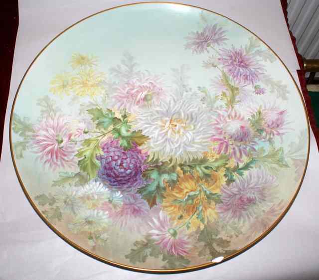 Appraisal: A LATE VICTORIAN EARTHENWARE DISH decorated chrysanthemums signed J Cliff