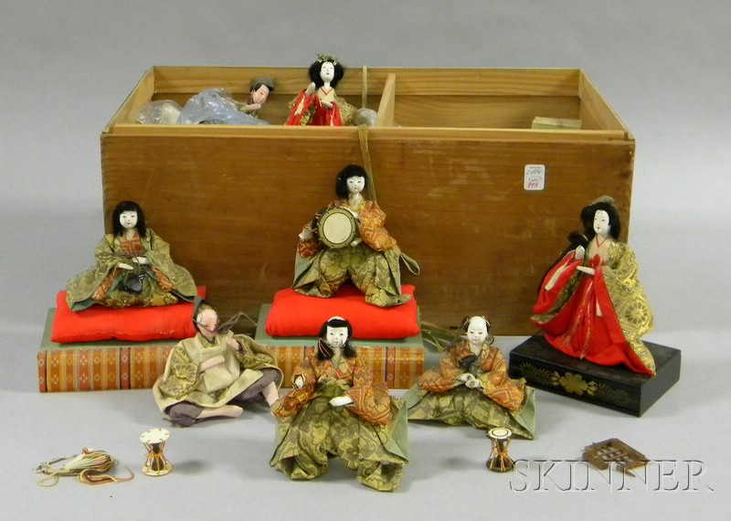 Appraisal: Fourteen Small Japanese Costume Dolls with accessories and lacquered stands