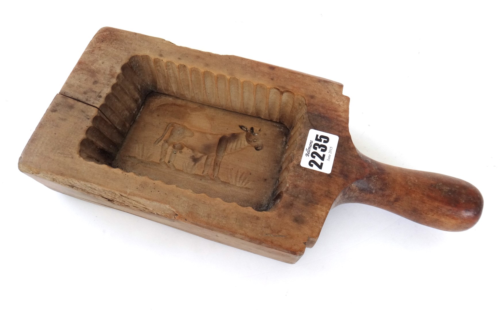 Appraisal: A vintage wooden butter mould relief carved to the interior