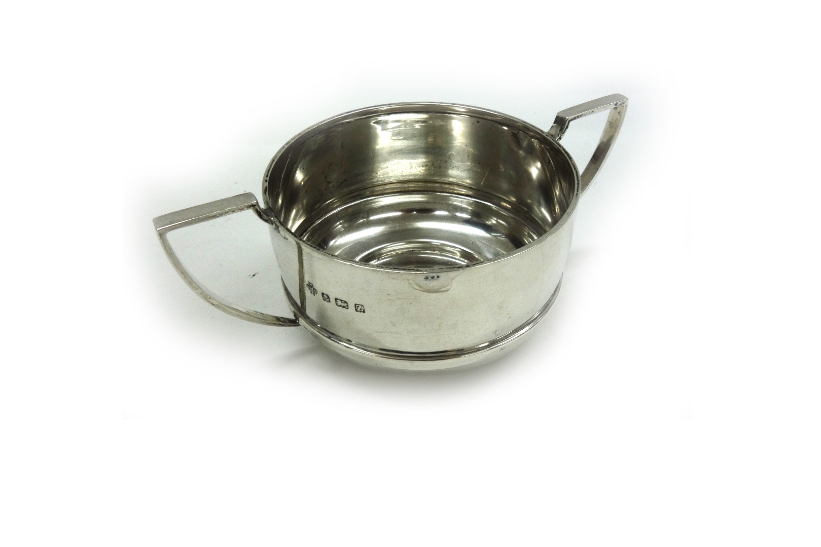 Appraisal: An Art Deco silver circular two handled sugar bowl William