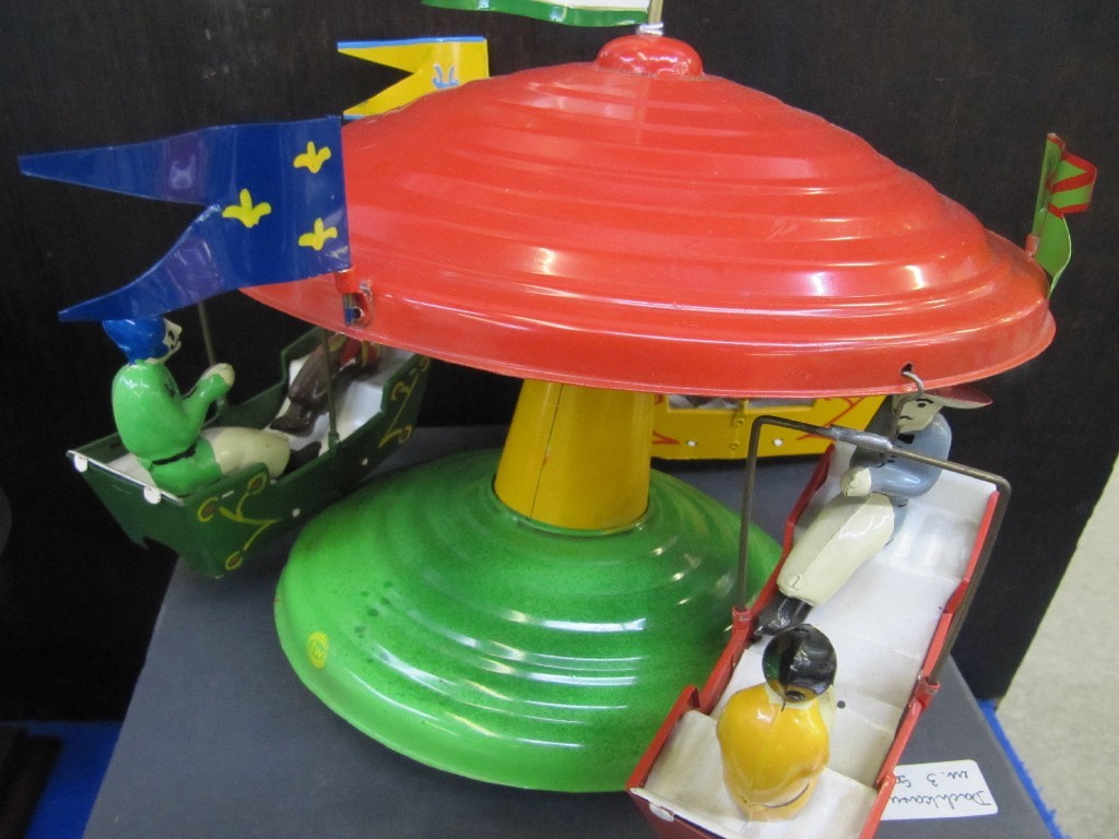 Appraisal: Tinplate toy merry-go-round