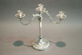 Appraisal: A three branched pedestal candelabra