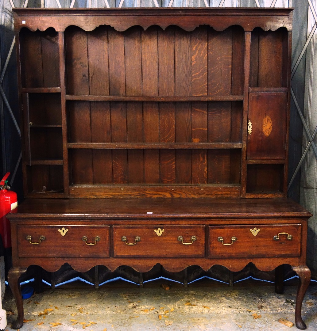 Appraisal: A mid th century mahogany banded oak dresser the three