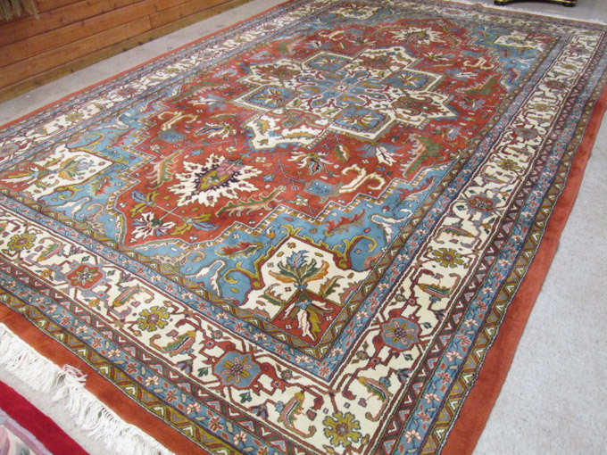 Appraisal: HAND KNOTTED ORIENTAL CARPET Indo-Heriz stylized floral and central floral