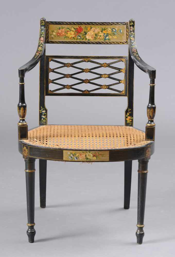 Appraisal: REGENCY STYLE PAINTED BLACK-GROUND ARMCHAIR The curved flower-painted rail above