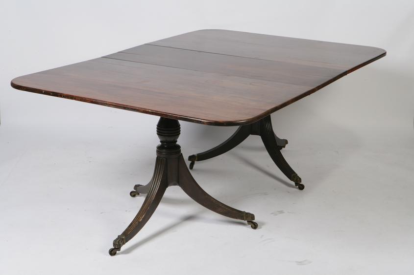 Appraisal: A GEORGE III MAHOGANY TWIN PEDESTAL DINING TABLE with two