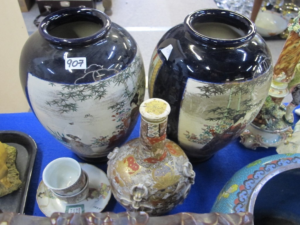 Appraisal: Pair of Satsuma vases Satsuma bottle vase and lid two