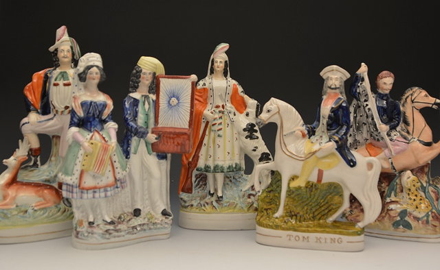 Appraisal: A group of five Staffordshire groupsVictorian including Tom King Hurdy