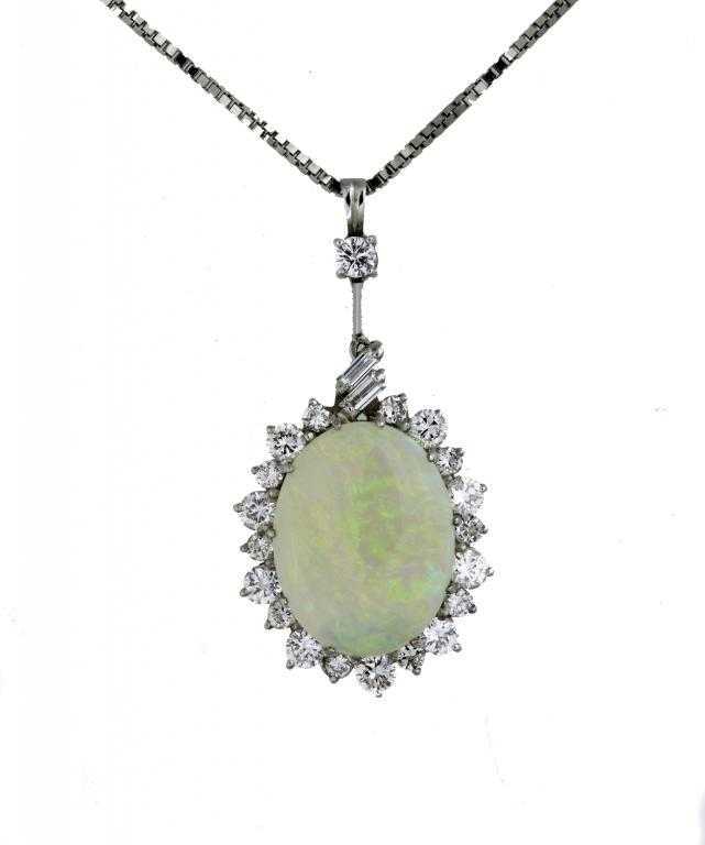 Appraisal: AN OPAL AND DIAMOND PENDANT the clustered opal suspended from