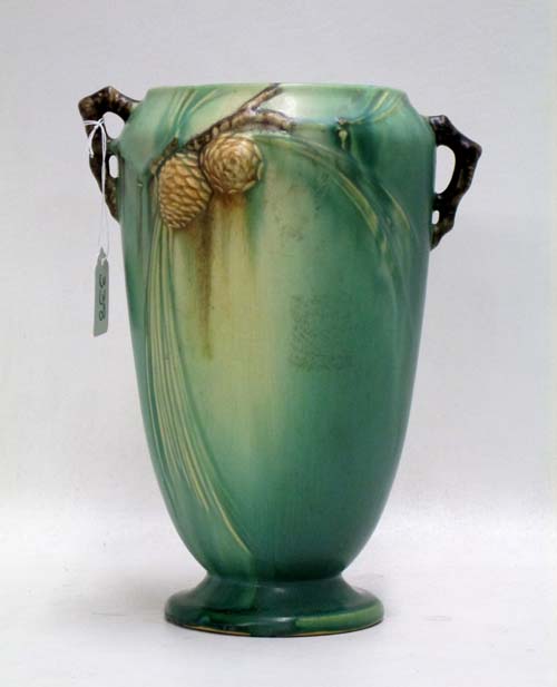 Appraisal: ROSEVILLE POTTERY PINECONE GREEN VASE with split twig handles marked