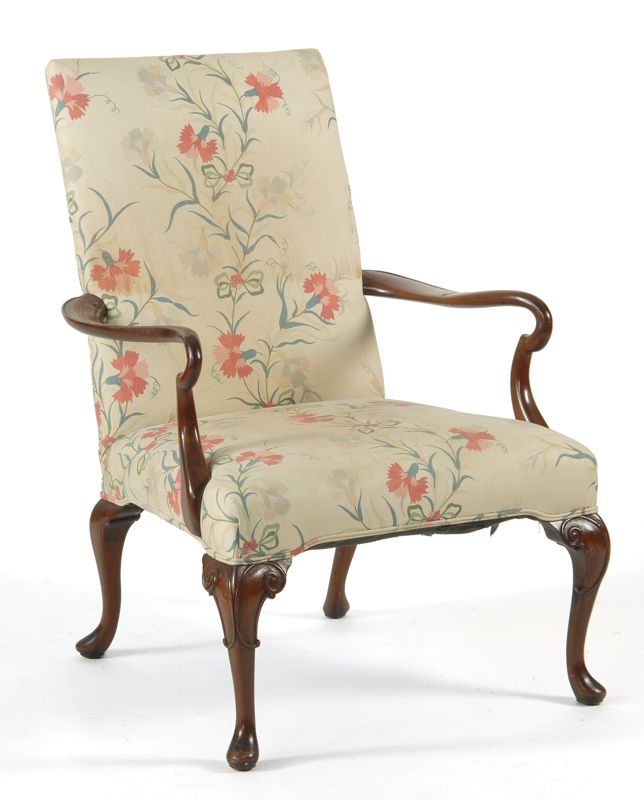 Appraisal: ANTIQUE AMERICAN UPHOLSTERED LOLLING CHAIR In mahogany with old finish