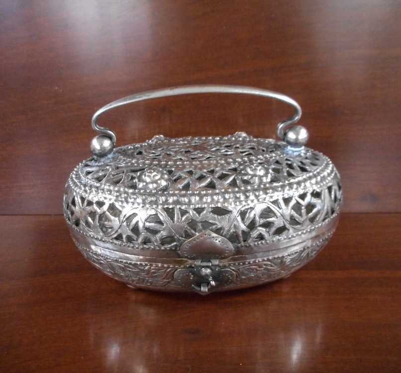 Appraisal: CHINESE SILVER CRICKET BOX with bale handle pierced oval body