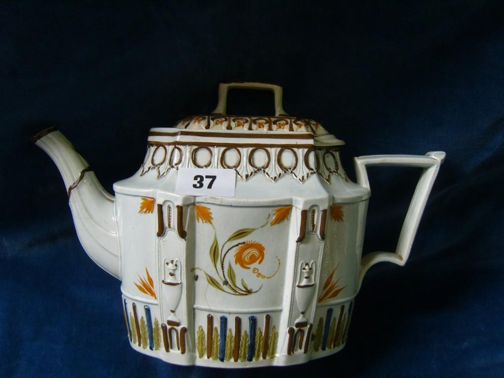 Appraisal: An early th century teapot of oval form with Pratt