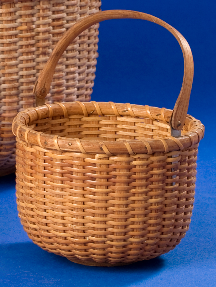 Appraisal: SMALL CIRCULAR NANTUCKET BASKET BY FERDINAND SYLVARO - With shaped