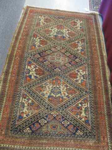 Appraisal: Kazak type Persian Handmade Rug semi-antique triangular and geometric designs