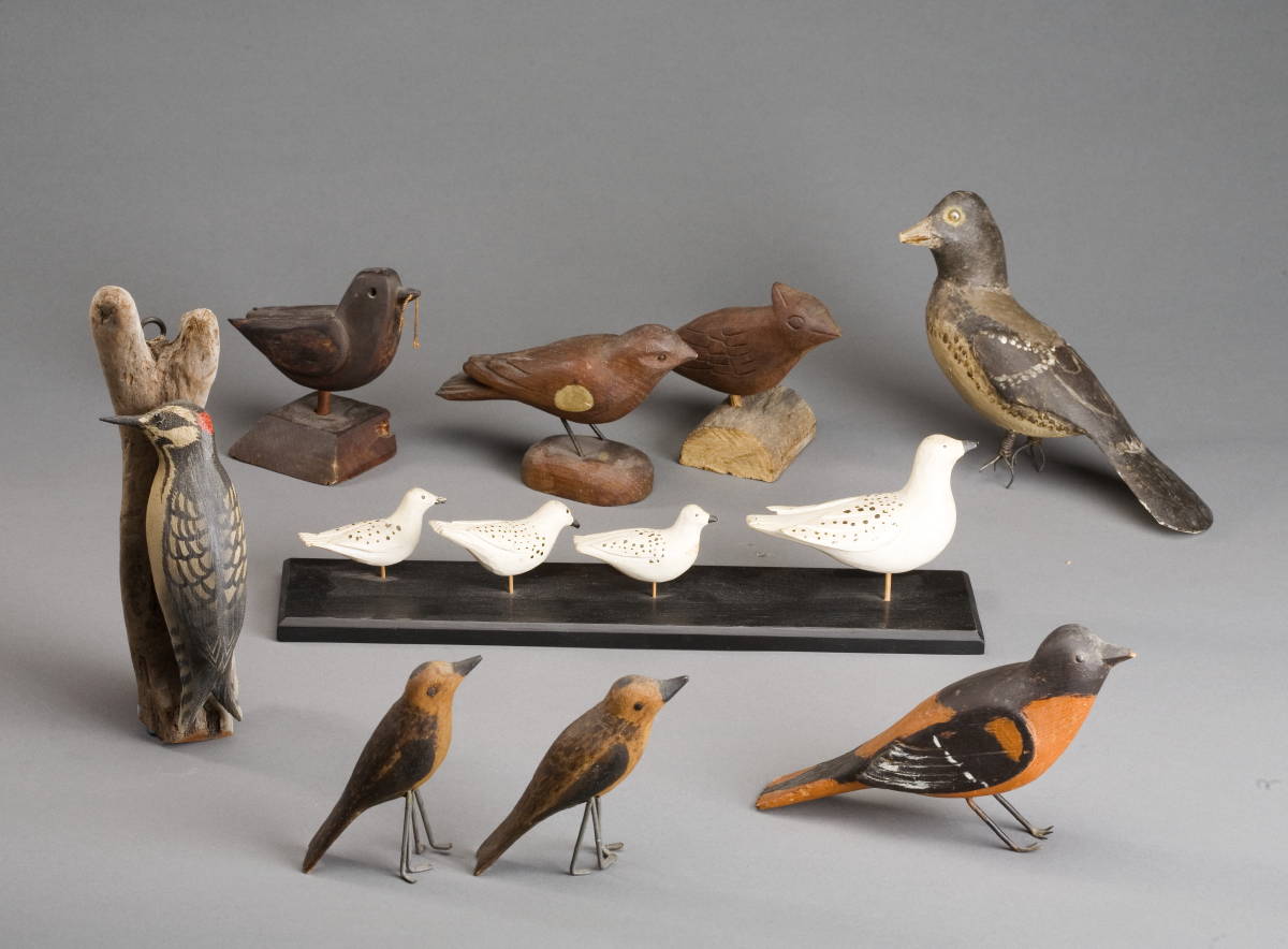 Appraisal: EIGHT CARVED AND PAINTED SONGBIRDS Together with a set of