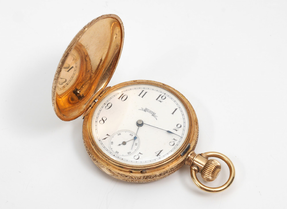 Appraisal: K GOLD ELGIN POCKET WATCH Profusely engraved k hunter case