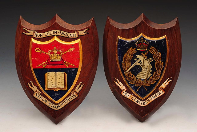 Appraisal: TWO ARMORIAL WOODEN SHIELDS each with painted Coats of Arms