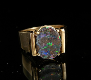 Appraisal: A Contemporary Black Opal Ring k yellow gold mount features