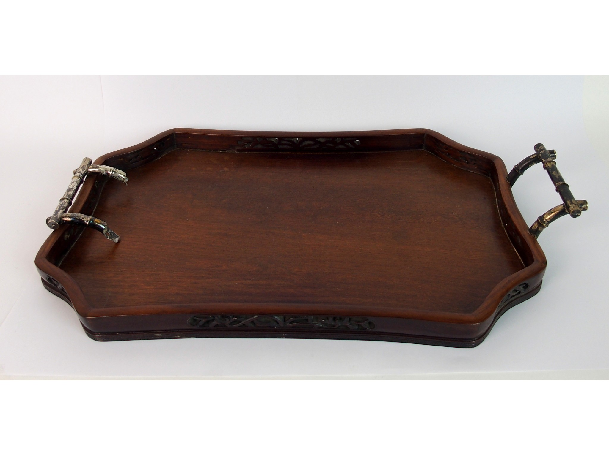 Appraisal: A Chinese hardwood octagonal shaped two handled tea traywith silver