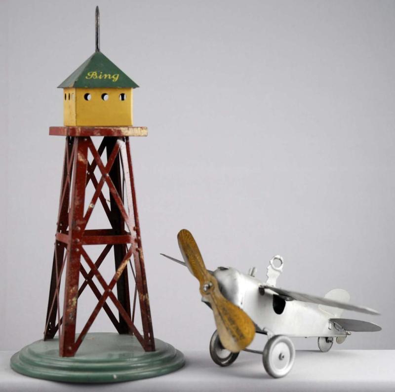 Appraisal: Bing Tin Wind-Up Airplane Tower Set Description German Marked DRGMBW