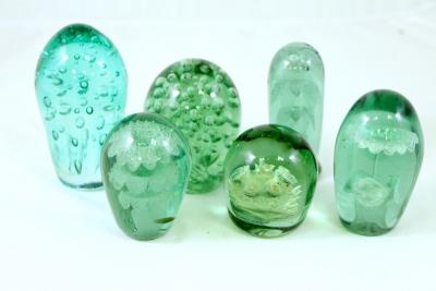 Appraisal: Six green glass dumps the largest cm high