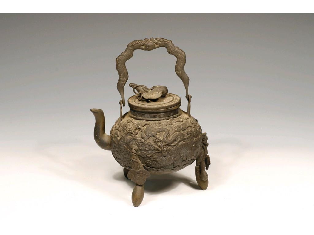 Appraisal: A CHINESE BRONZE TEAPOT the bulbous body with relief decoration