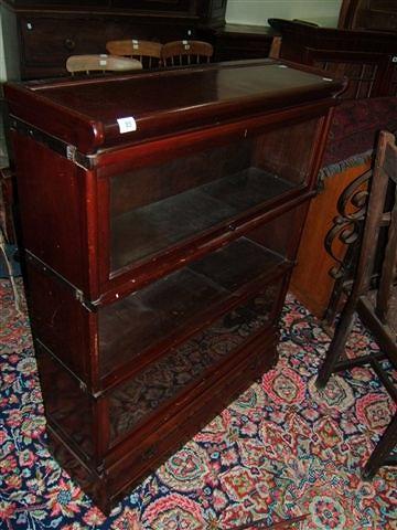 Appraisal: A Globe Wernicke style mahogany three section bookcase wide