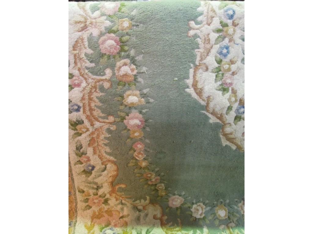 Appraisal: An Aubusson style wool rug with a central floral medallion