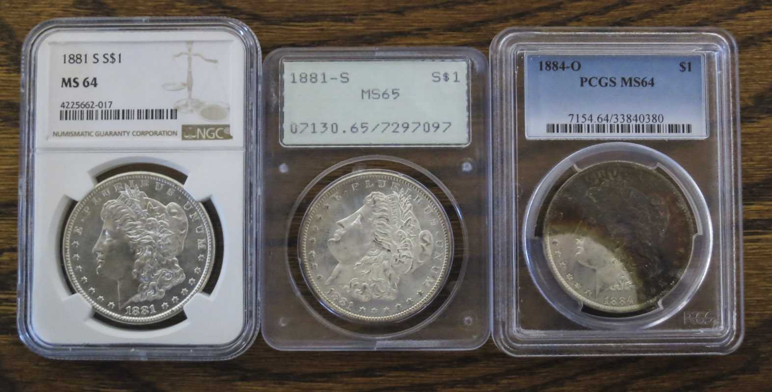 Appraisal: THREE U S SILVER MORGAN DOLLARS -S PCGS encapsulated and