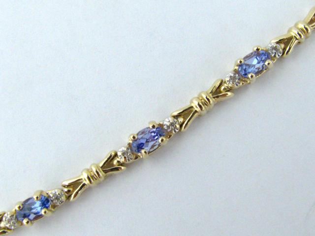 Appraisal: k yellow gold tanzanite and diamond bracelet MSRP sku