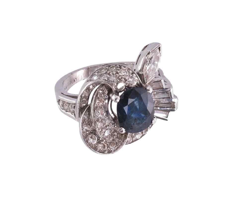 Appraisal: PLATINUM CT SAPPHIRE WITH DIAMONDS RING Platinum ring centers a