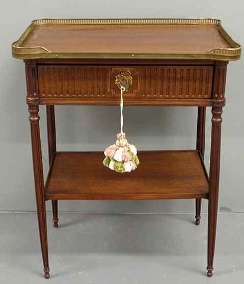 Appraisal: French Empire style mahogany end table with a brass galleried